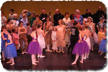 Cast gathers on stage