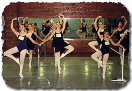 Intermediate and Advanced girls auditioning at the barre.